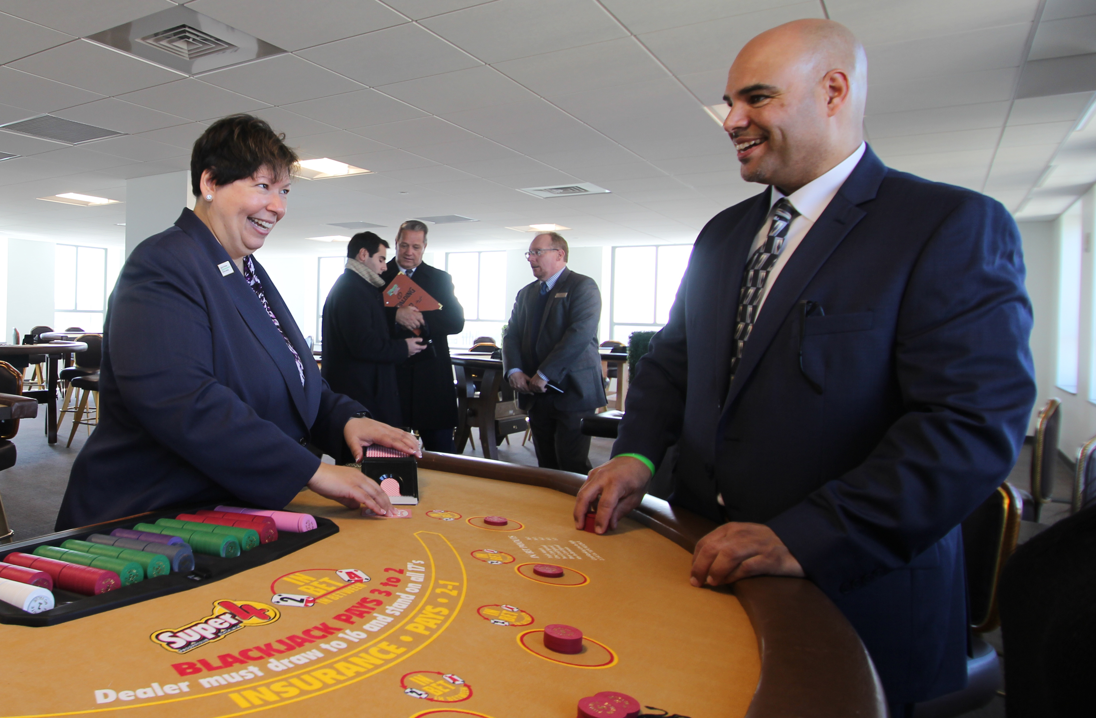 Christina Royal acts as dealer at a blackjack table